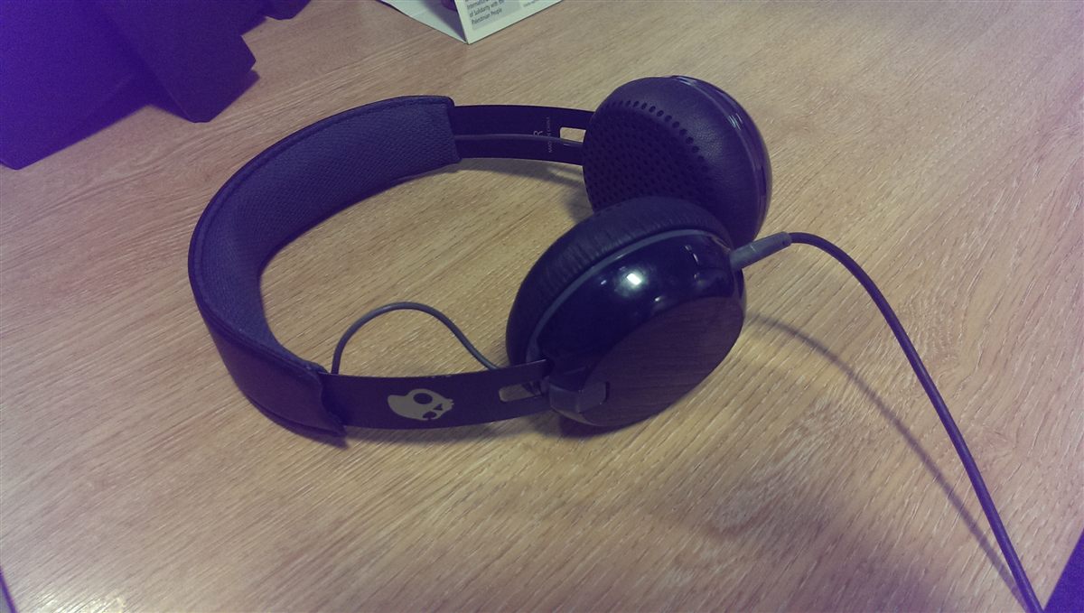 Headphones and laptop checking Opus to MP3 Converter Online bitrate choices